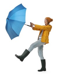 Woman with blue umbrella on white background