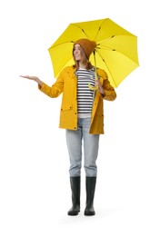 Photo of Woman with yellow umbrella on white background