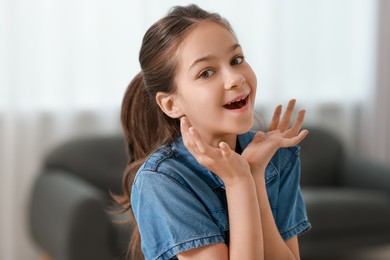 Portrait of emotional little girl indoors. Cute child