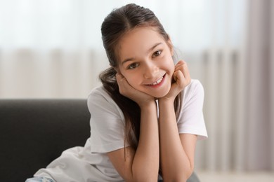 Portrait of happy little girl indoors. Cute child