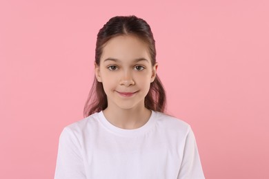 Portrait of beautiful girl on pink background