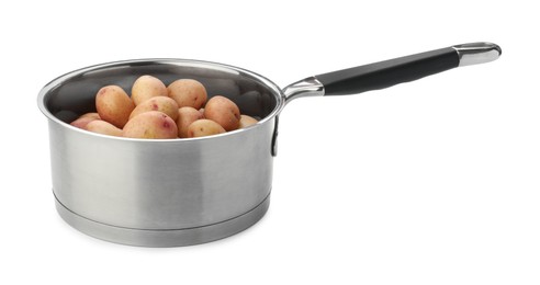 Photo of Raw potatoes in saucepan isolated on white