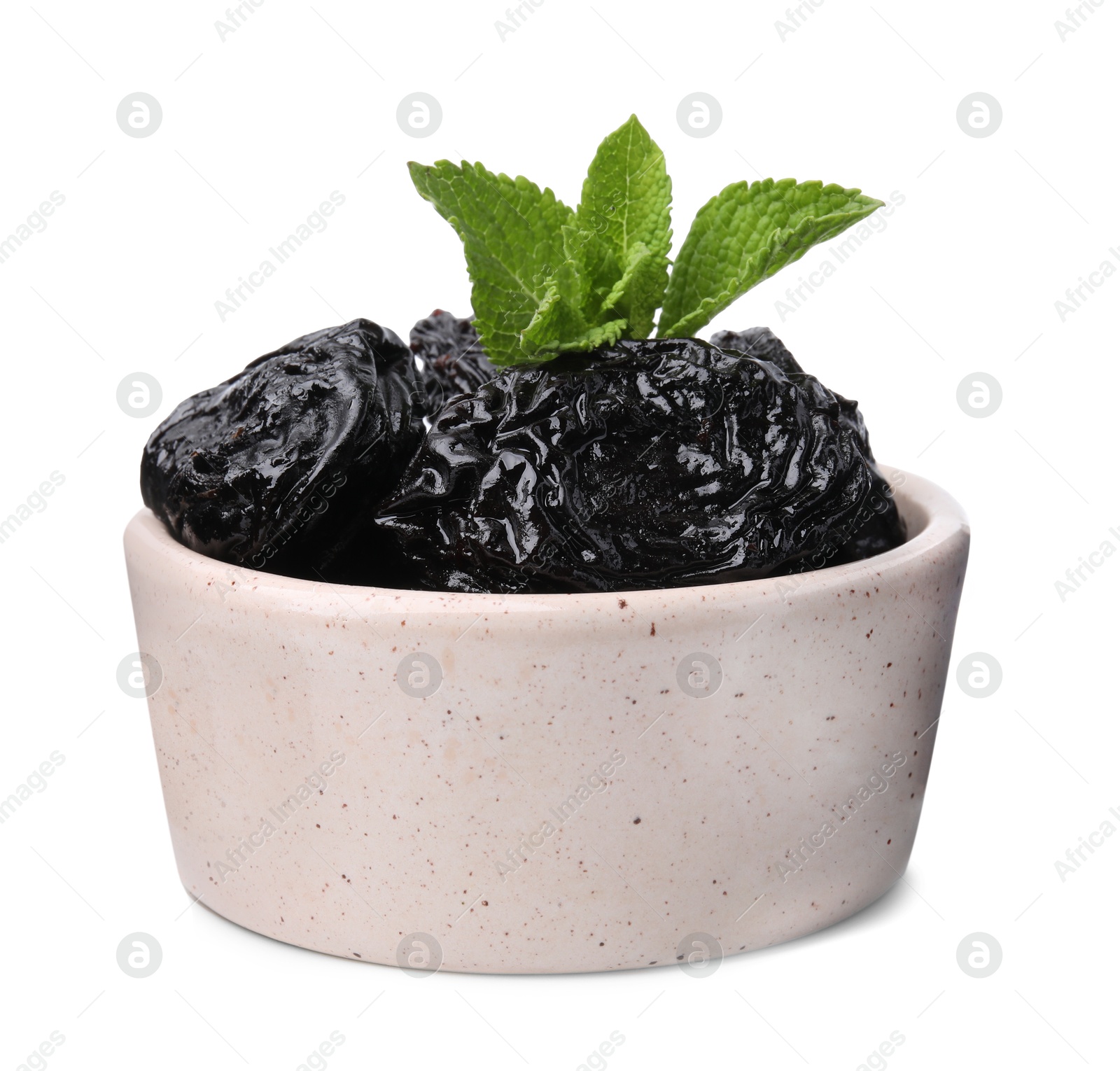 Photo of Tasty dried plums (prunes) and mint leaves in bowl on white background