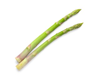 Photo of Fresh green asparagus stems isolated on white, top view