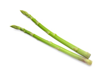 Photo of Fresh green asparagus stems isolated on white, top view