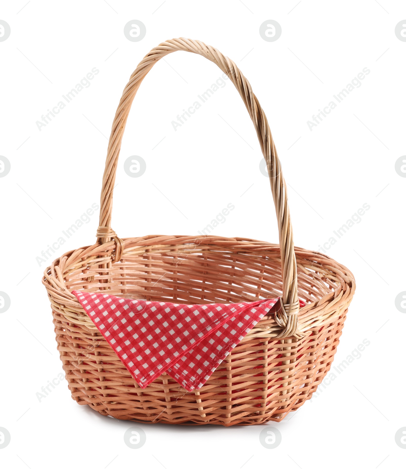 Photo of One picnic wicker basket with checkered napkin isolated on white