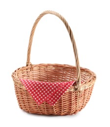 Photo of One picnic wicker basket with checkered napkin isolated on white