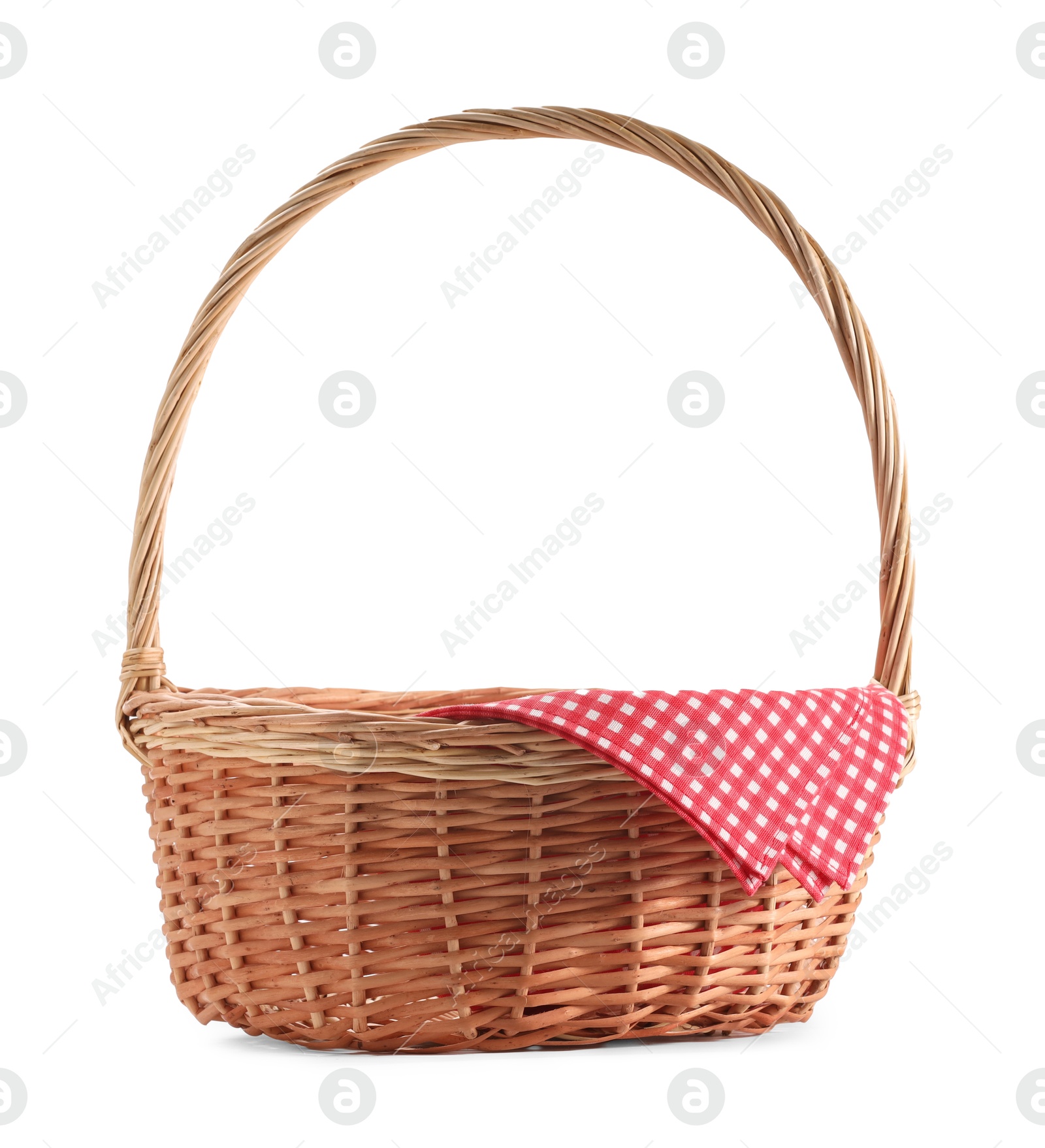 Photo of One picnic wicker basket with checkered napkin isolated on white