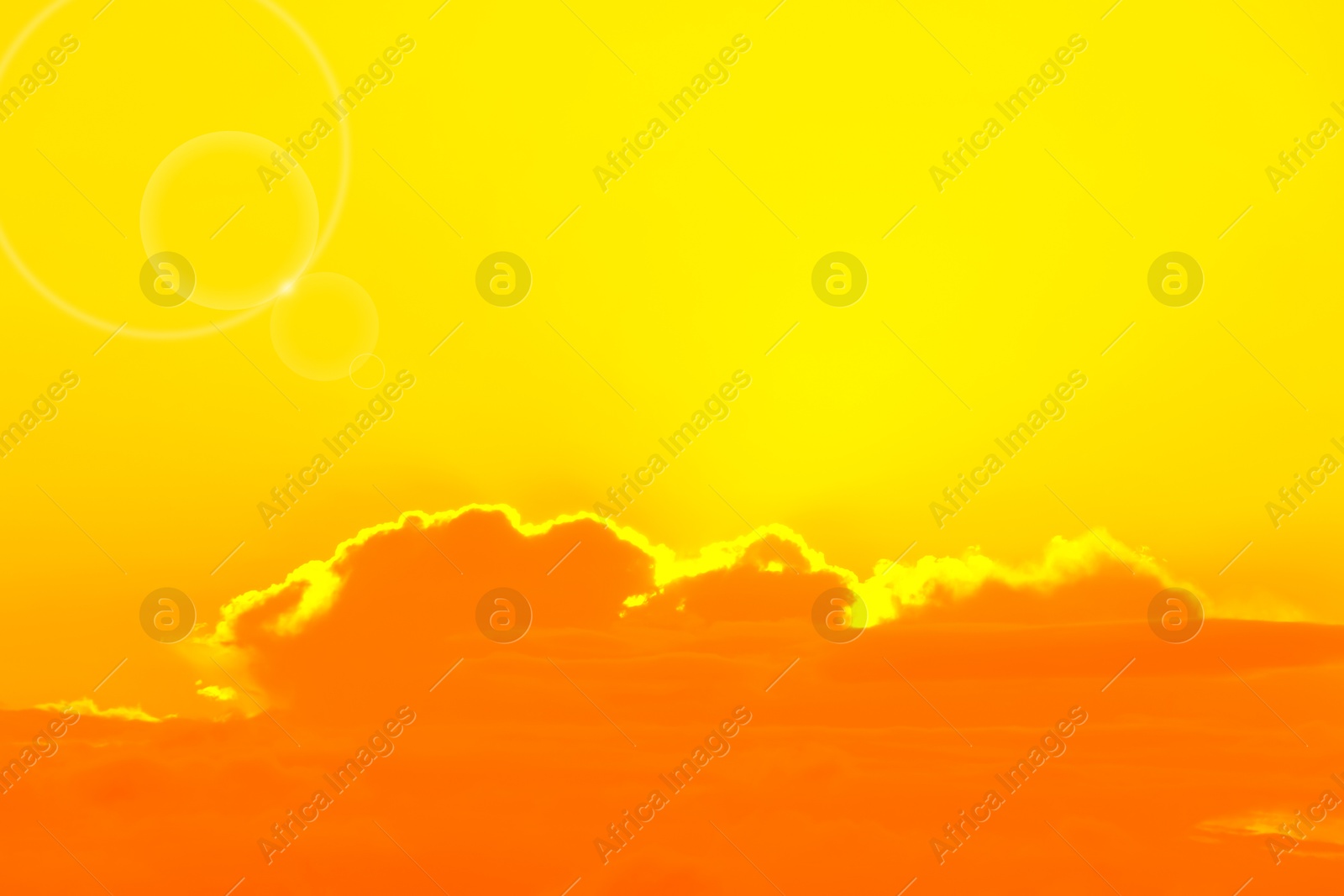 Image of Orange sky with clouds during hot summer weather