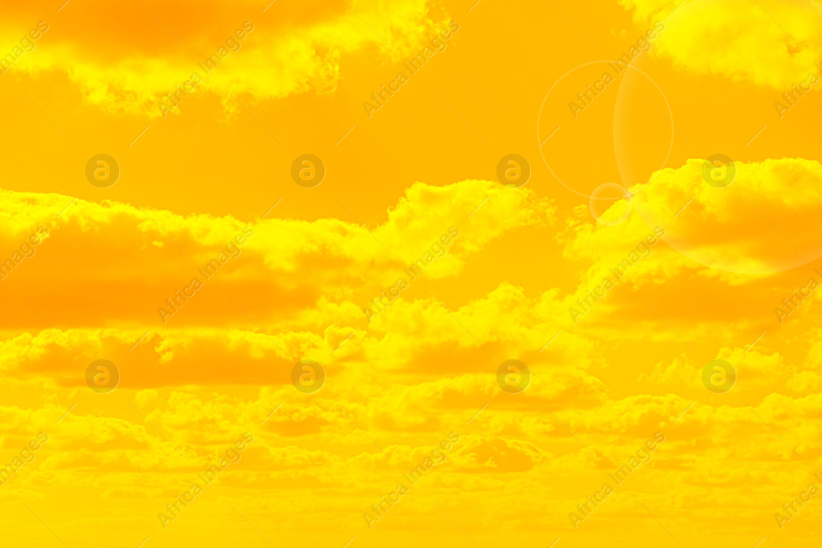 Image of Orange sky with clouds during hot summer weather