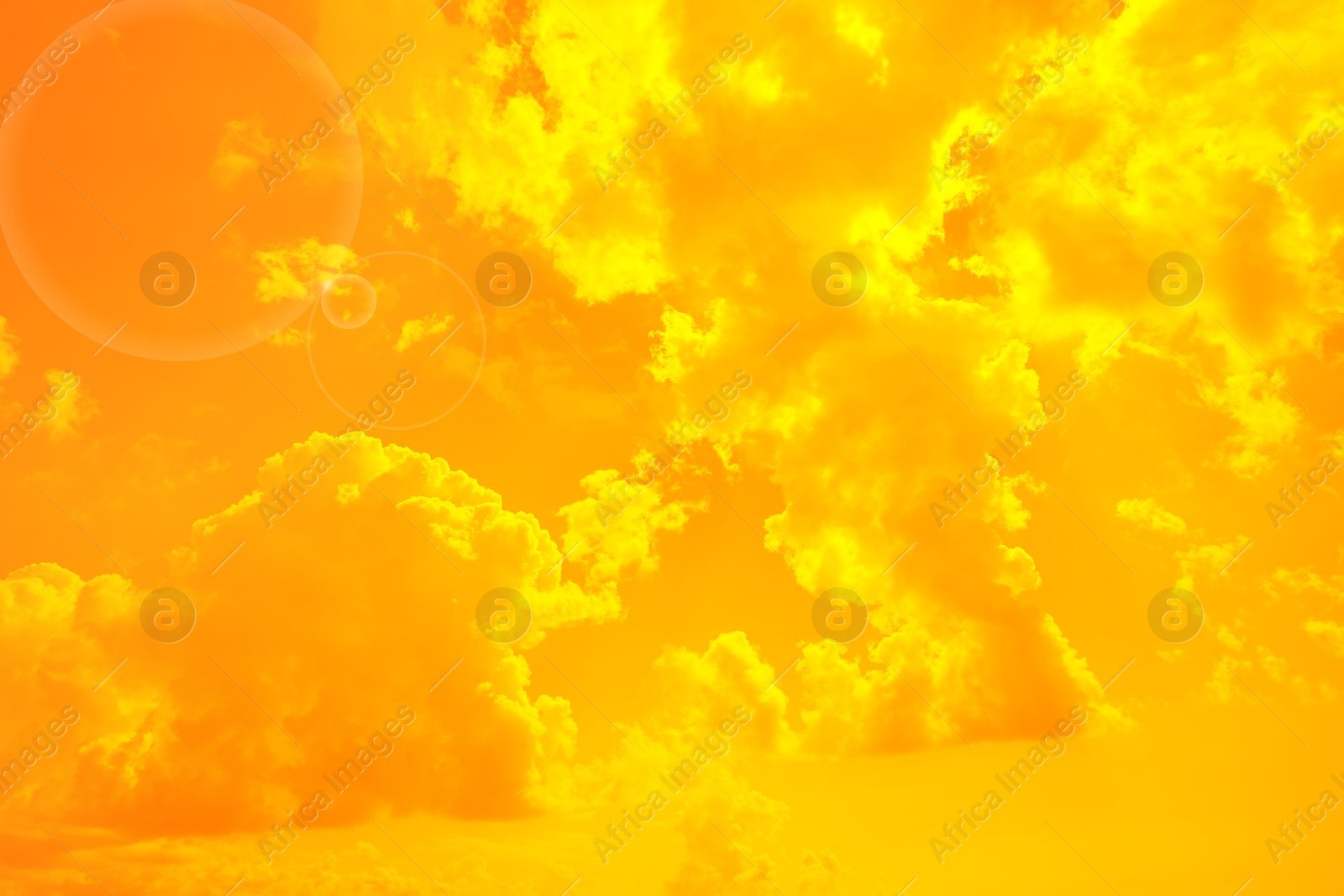 Image of Orange sky with clouds during hot summer weather