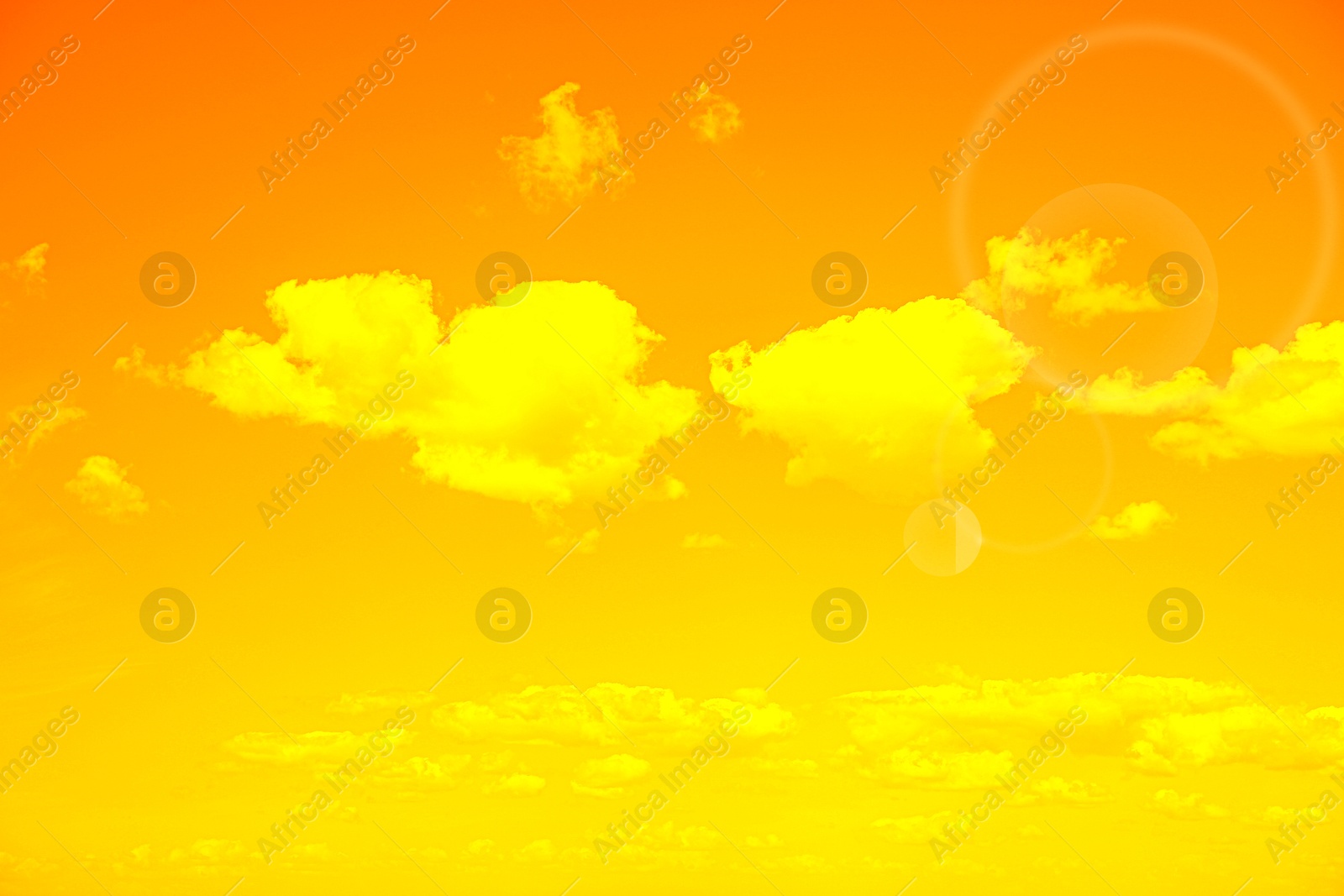 Image of Orange sky with clouds during hot summer weather