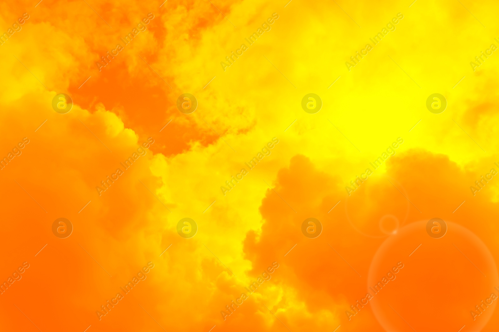 Image of Orange sky with clouds during hot summer weather