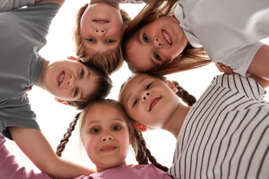 Photo of Group of cute little children indoors, bottom view