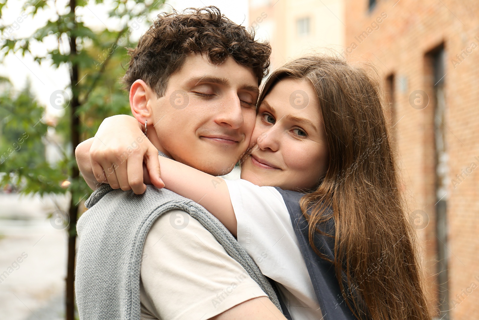 Photo of International dating. Lovely young couple spending time together outdoors