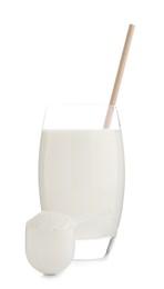 Delicious protein shake in glass and scoop with powder isolated on white