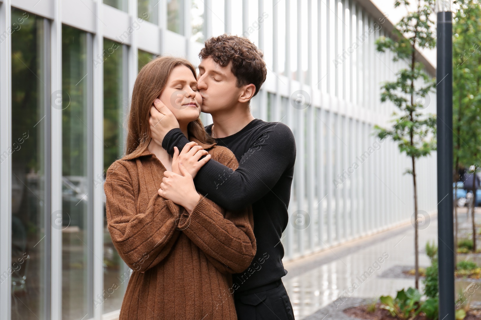 Photo of International dating. Lovely young couple spending time together outdoors, space for text