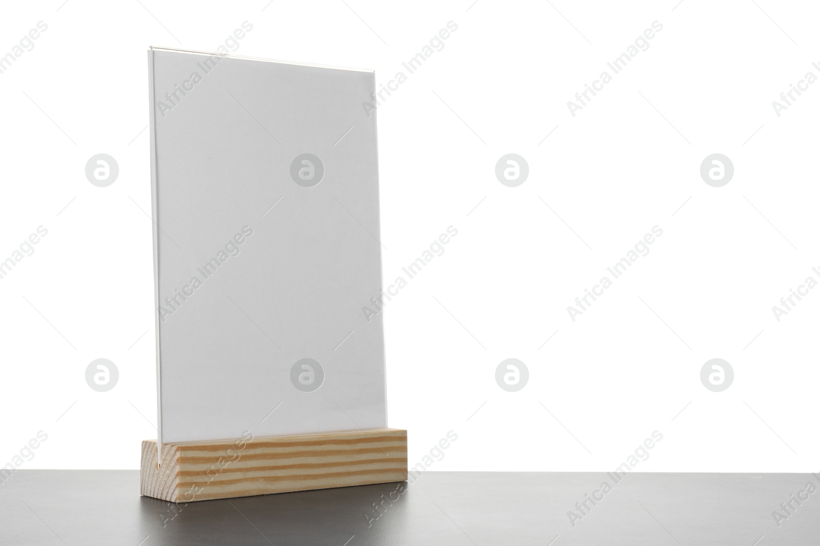 Photo of Menu holder on grey table against white background. Space for text