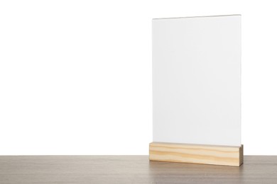 Photo of Menu holder on wooden table against white background. Space for text