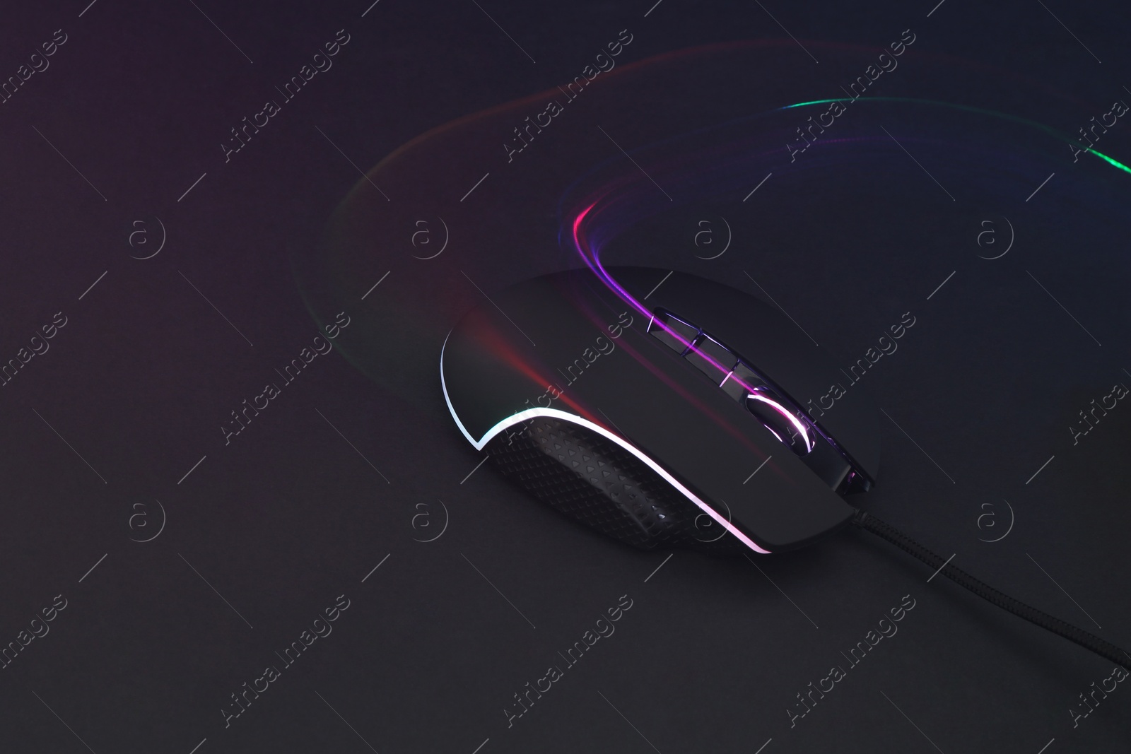 Photo of Computer mouse on dark background, space for text