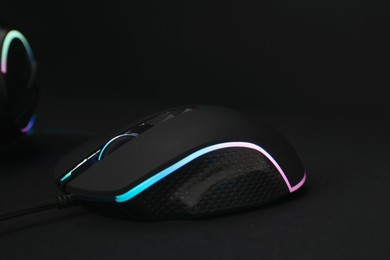 Photo of Computer mouse on black background, closeup view