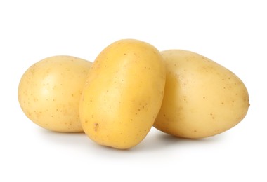 Photo of Three young fresh potatoes isolated on white