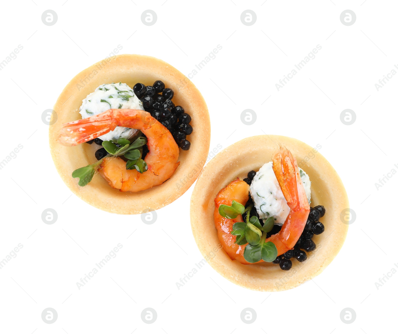 Photo of Delicious canapes with shrimps and black caviar isolated on white, top view