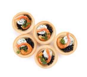 Delicious canapes with shrimps and black caviar isolated on white, top view