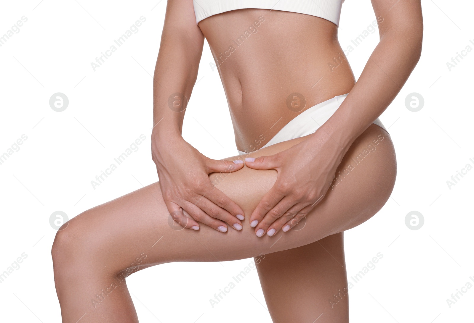 Photo of Woman in underwear making heart with hands near thigh on white background, closeup. Cellulite problem