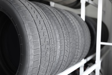 Group of car tires in auto store, closeup