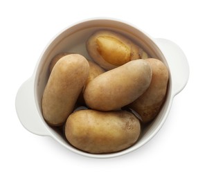 Raw potatoes in pot with water isolated on white, top view