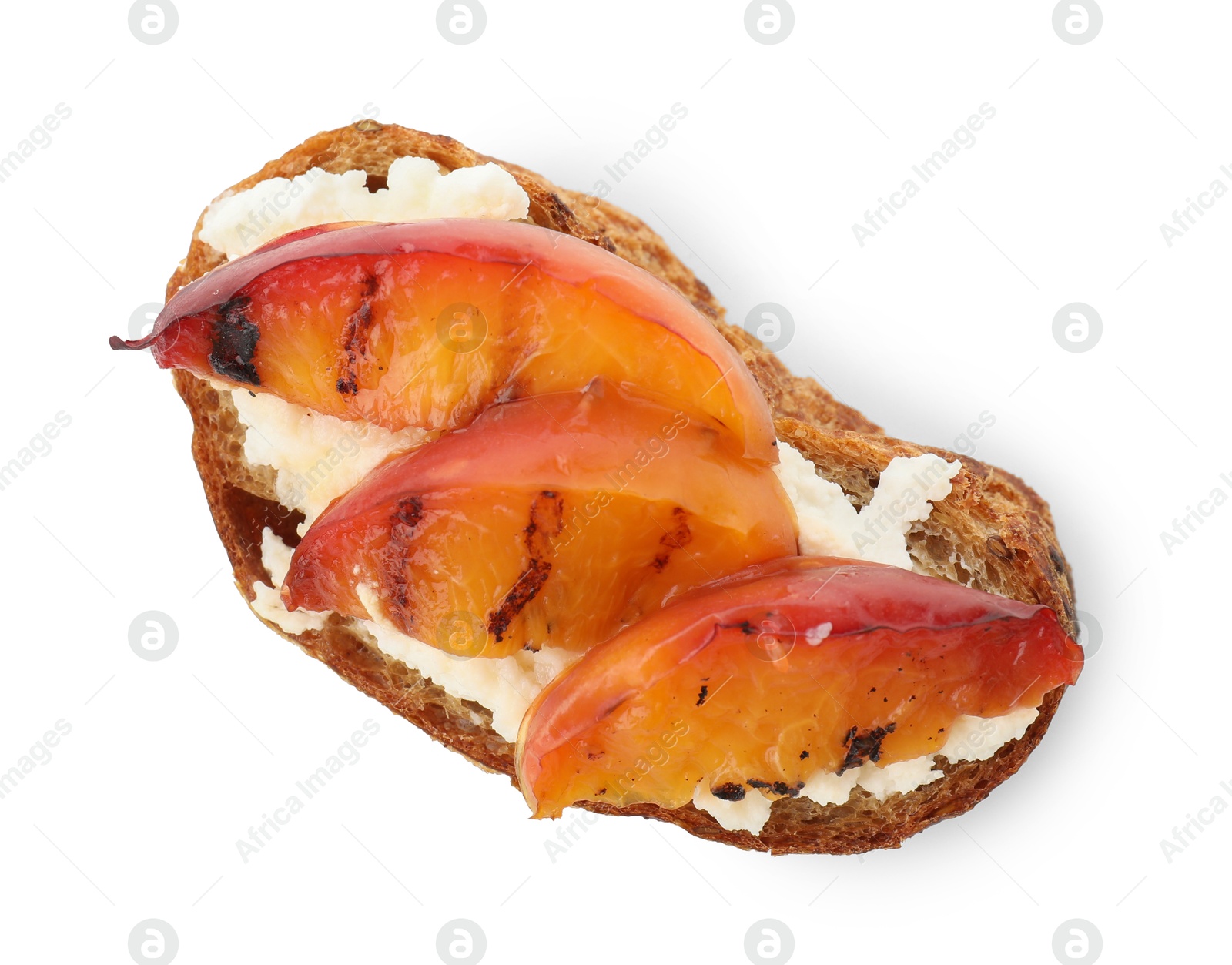 Photo of Delicious bruschetta with ricotta cheese and peach isolated on white, top view