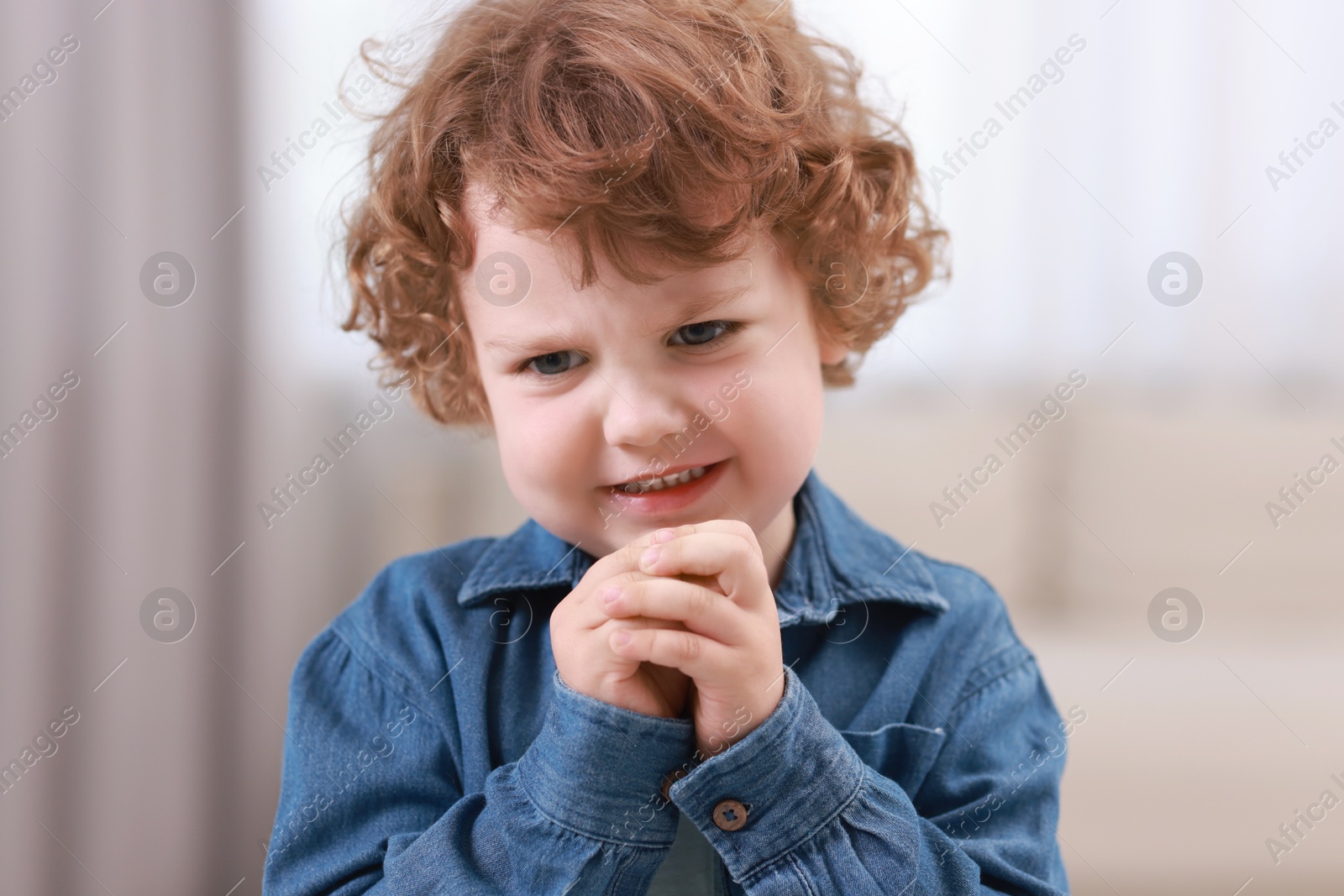 Photo of Portrait of emotional little boy indoors. Cute child