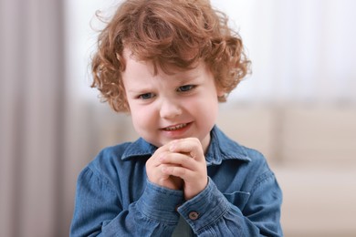 Photo of Portrait of emotional little boy indoors. Cute child