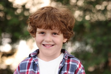 Portrait of little boy outdoors. Cute child