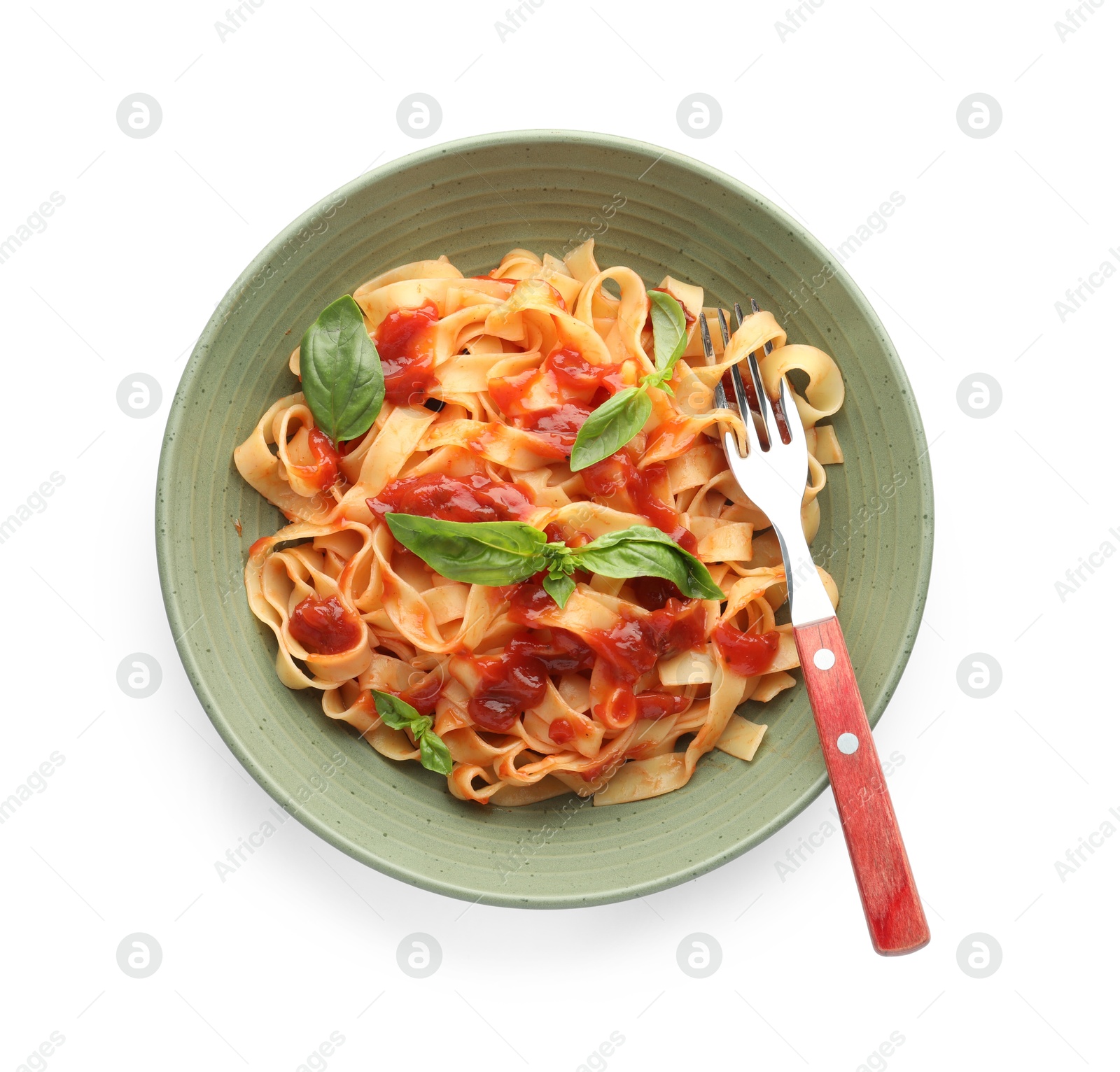 Photo of Delicious pasta with tomato sauce, basil and fork in bowl isolated on white, top view