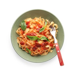 Photo of Delicious pasta with tomato sauce, basil and fork in bowl isolated on white, top view