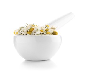 Photo of Mortar and pestle with chamomile flowers isolated on white