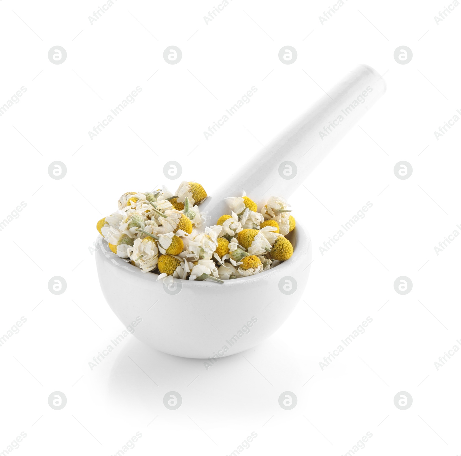 Photo of Mortar and pestle with chamomile flowers isolated on white