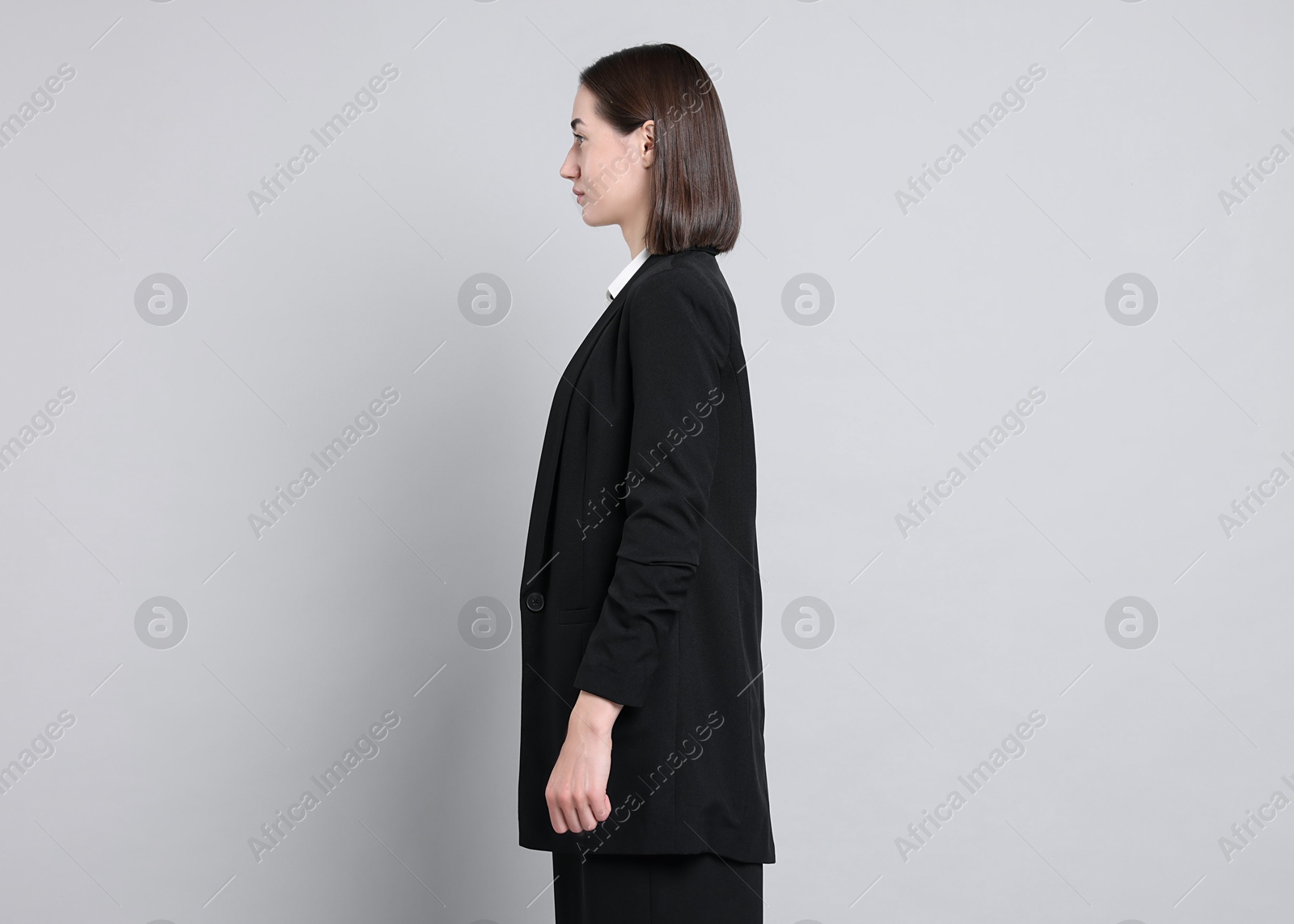 Photo of Woman with good posture on gray background