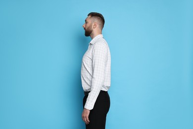 Photo of Man with good posture on light blue background
