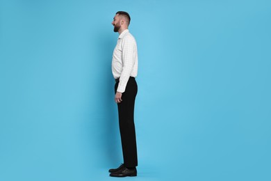 Photo of Man with good posture on light blue background