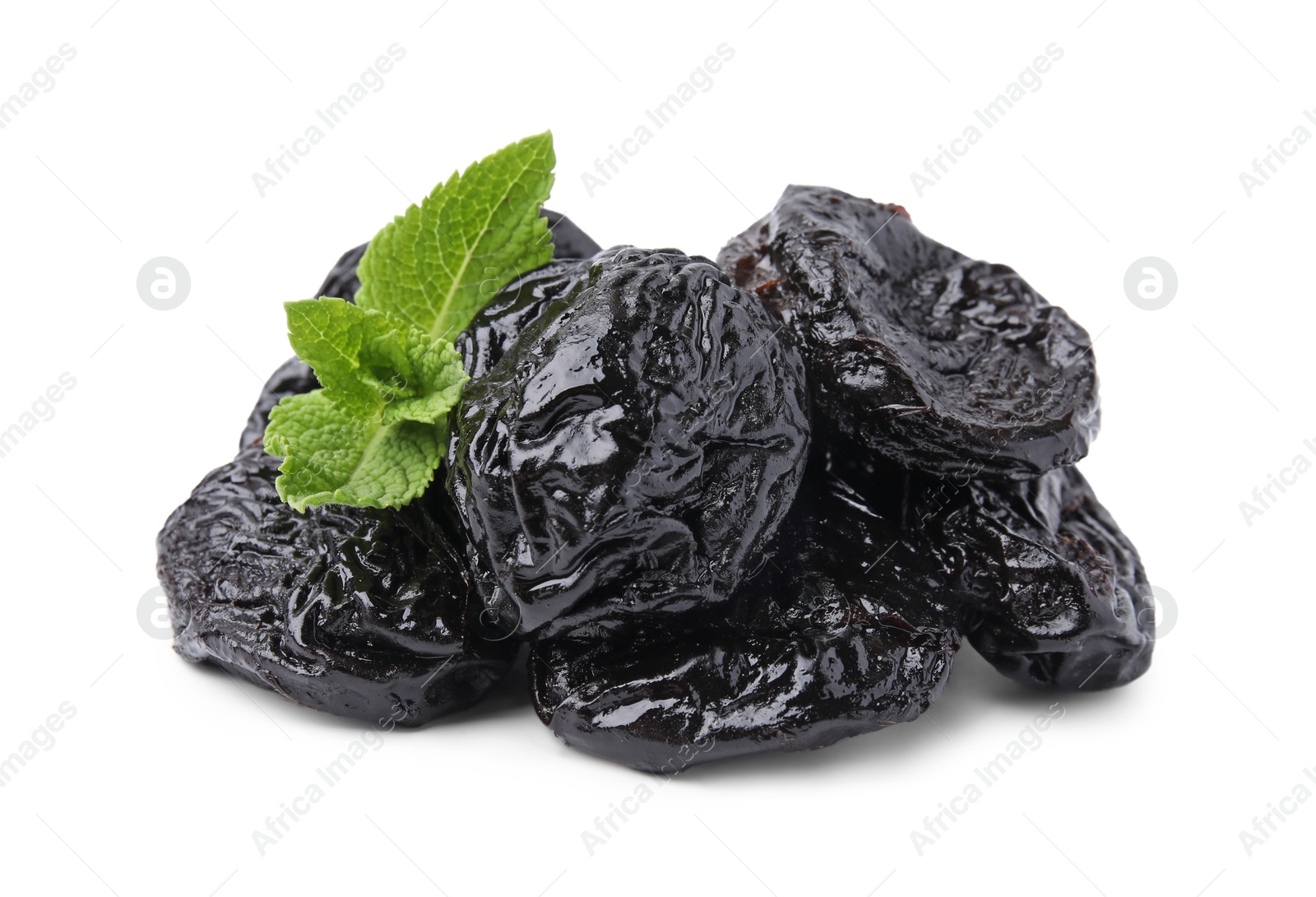 Photo of Tasty dried plums (prunes) and mint leaves on white background