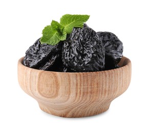 Photo of Tasty dried plums (prunes) and mint leaves in wooden bowl on white background