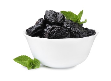 Photo of Tasty dried plums (prunes) and mint leaves in bowl on white background