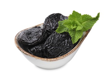 Photo of Tasty dried plums (prunes) and mint leaves on white background