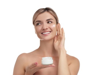 Beautiful woman with jar of face cream on white background