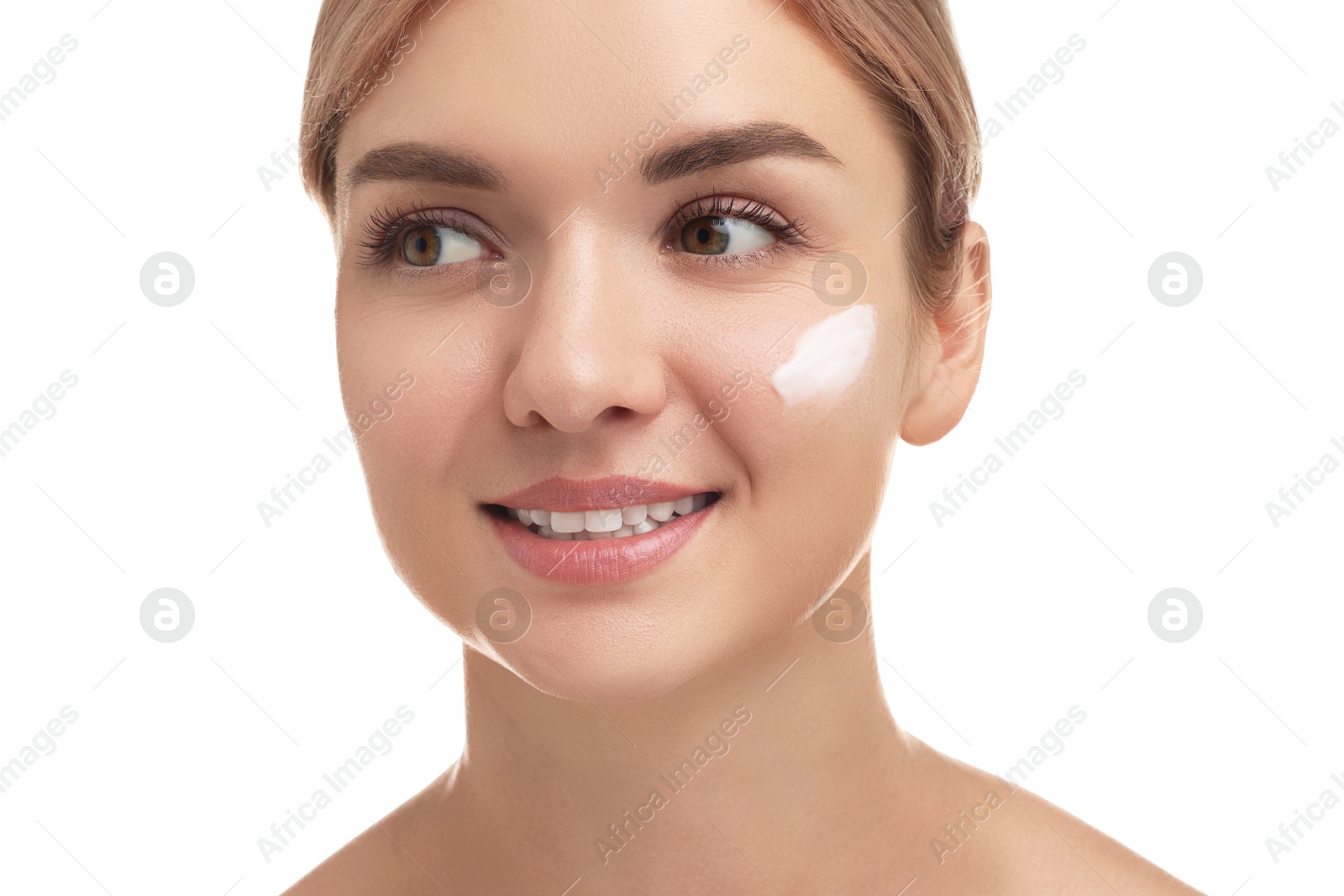 Photo of Beautiful woman with cream on her face against white background, closeup