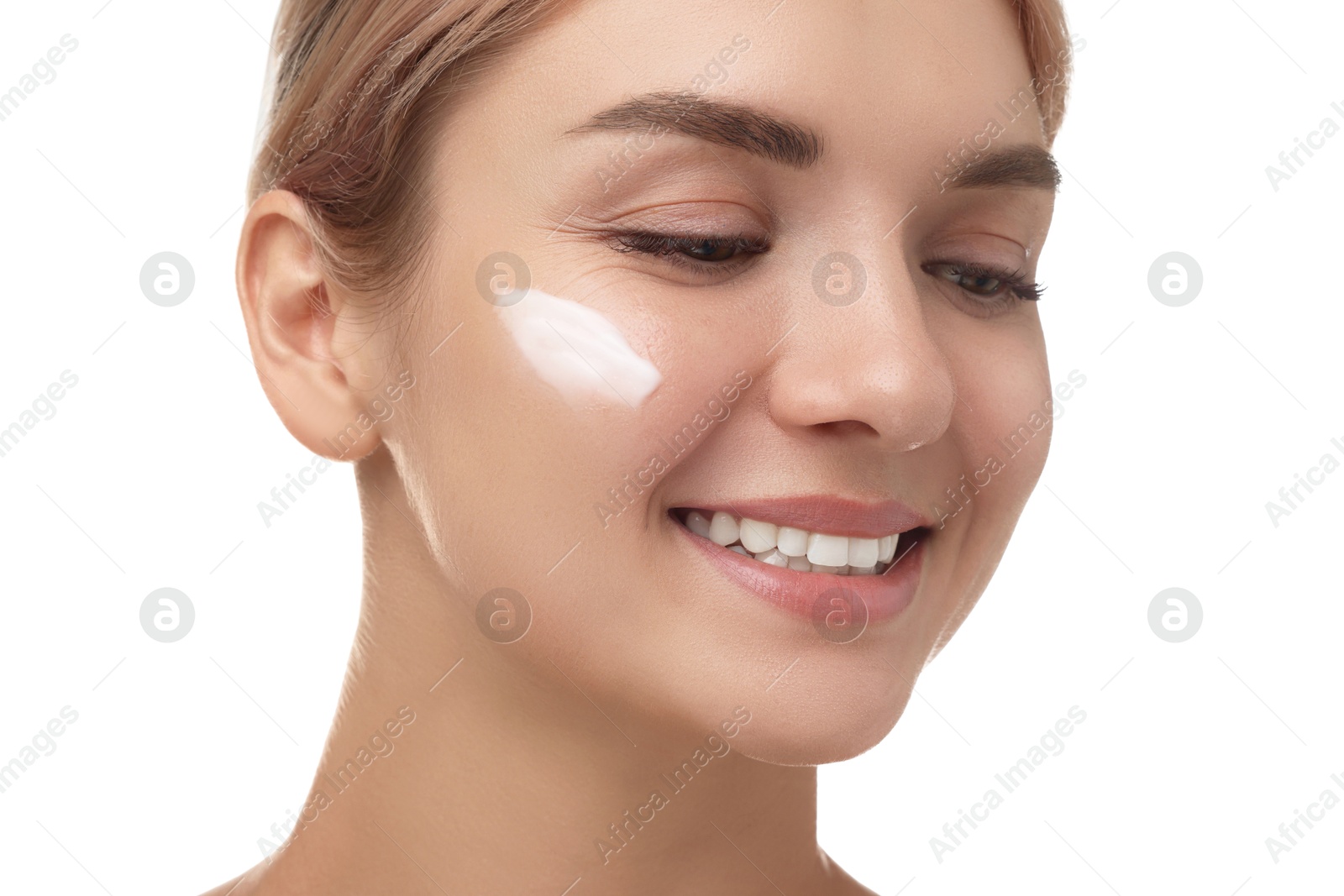 Photo of Beautiful woman with cream on her face against white background, closeup