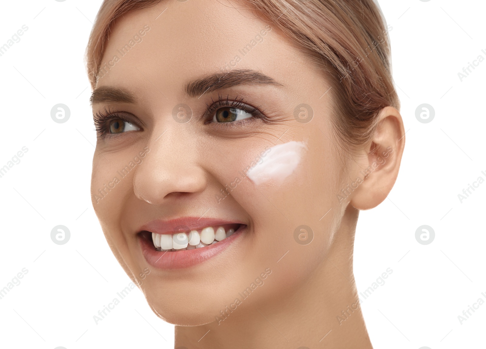 Photo of Beautiful woman with cream on her face against white background, closeup